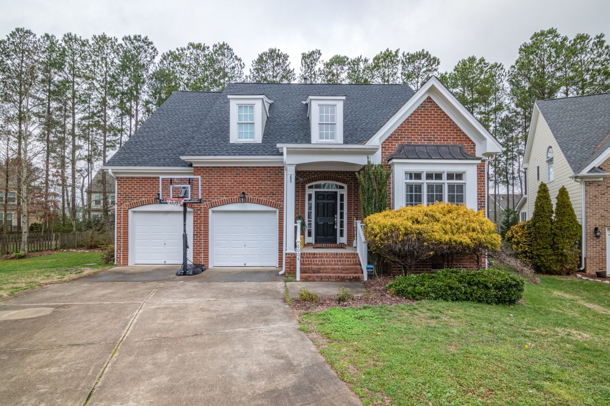 A brick single-family home with a two-car garage